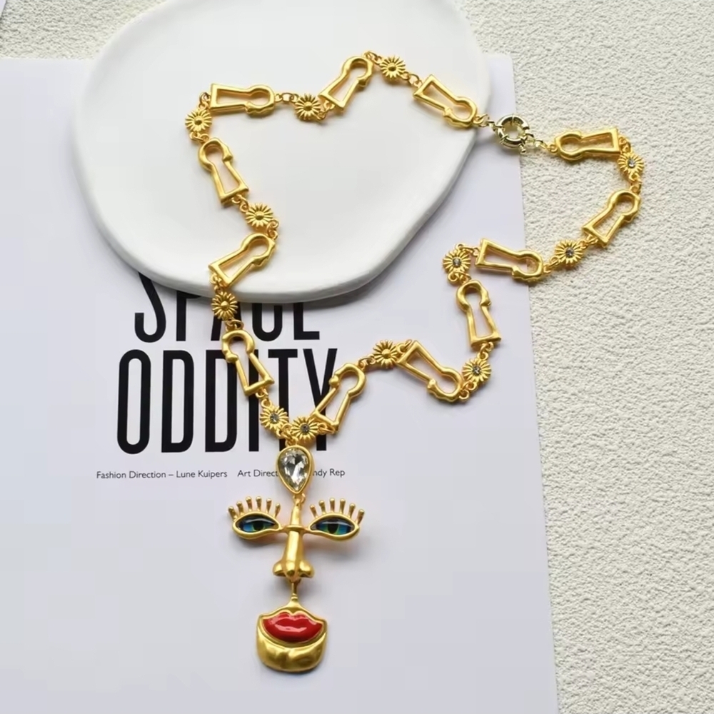Gold-tone Abstract Face Pendant Necklace with Red Lips - Picture 2 of 5